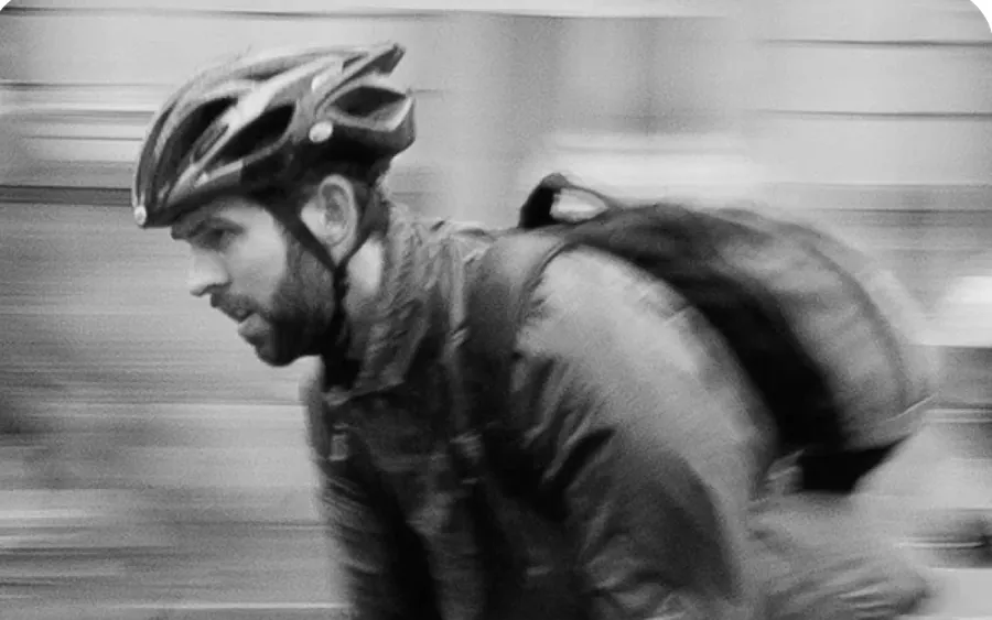 A commuter in a vented bicycle helmet