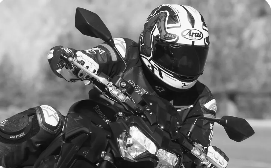 A rider in a closed full-face helmet
