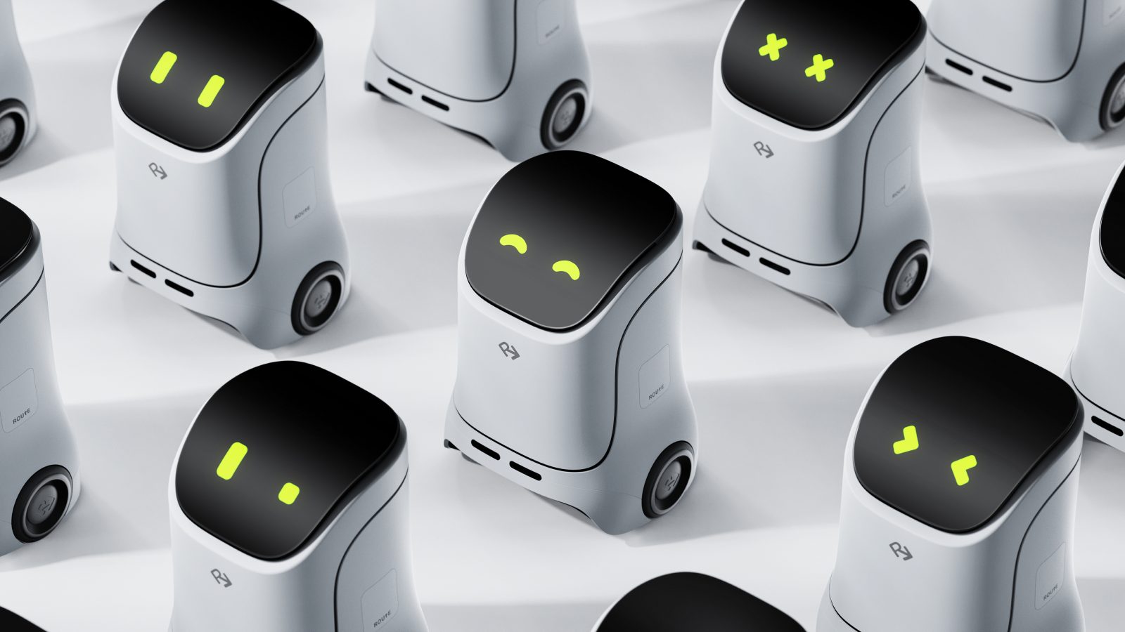 A group of ROUTE robots, each screen showing a different face