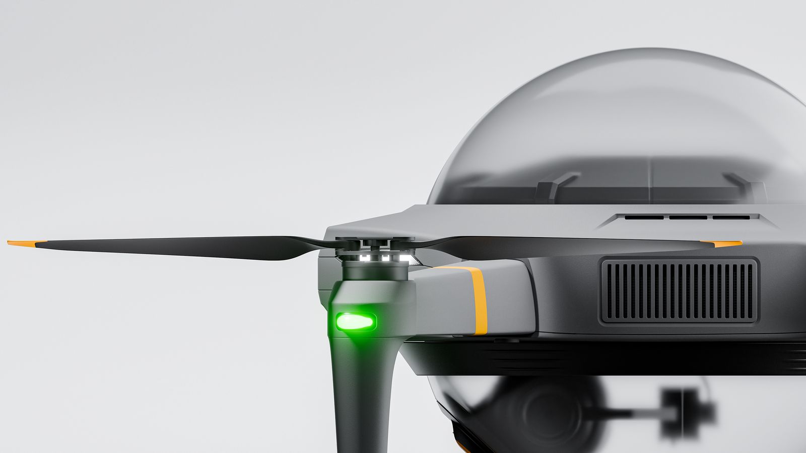 An arm tip with its green light, beside the vented body