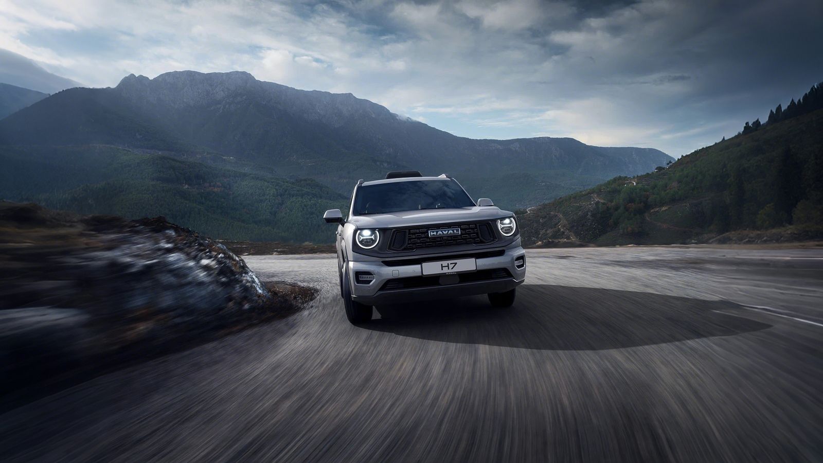 The same SUV on a mountain road